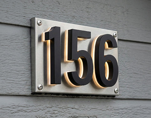 Pre-mounted backlit house numbers on a matched backing plate